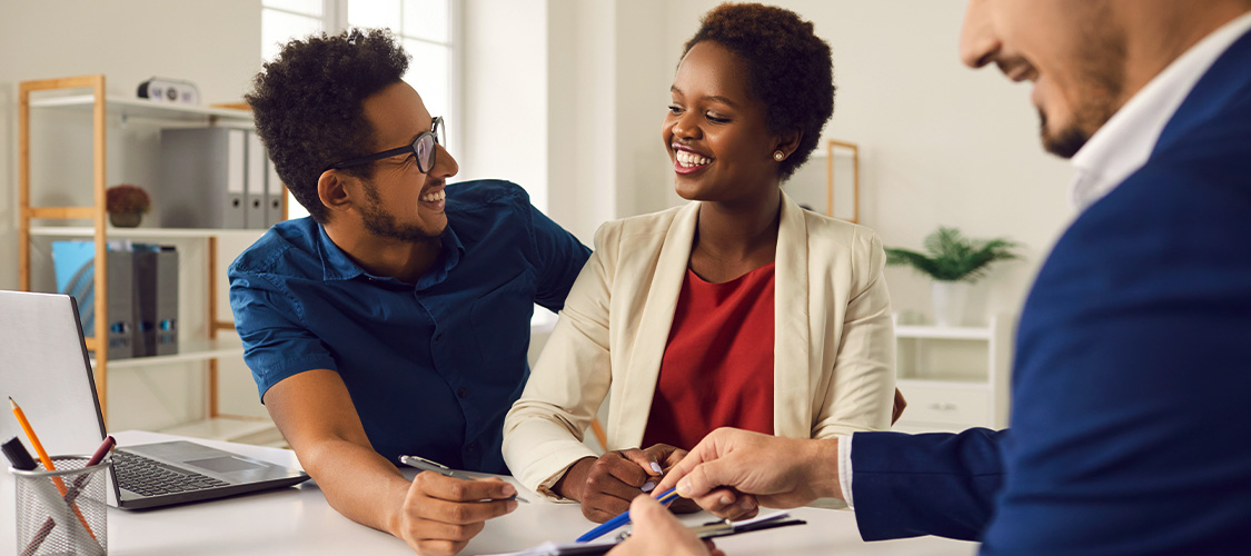 A couple talking with a loan officer