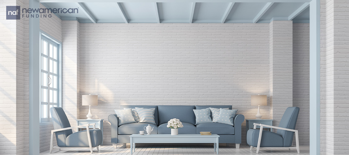 A living room with a blue ceiling.
