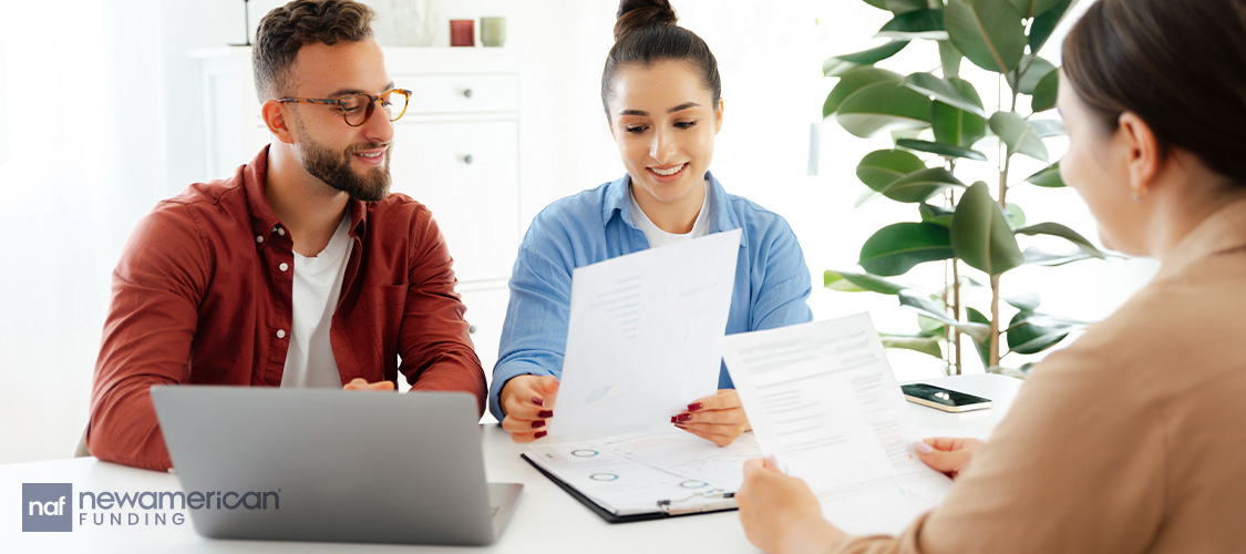 A couple meeting with a loan officer.