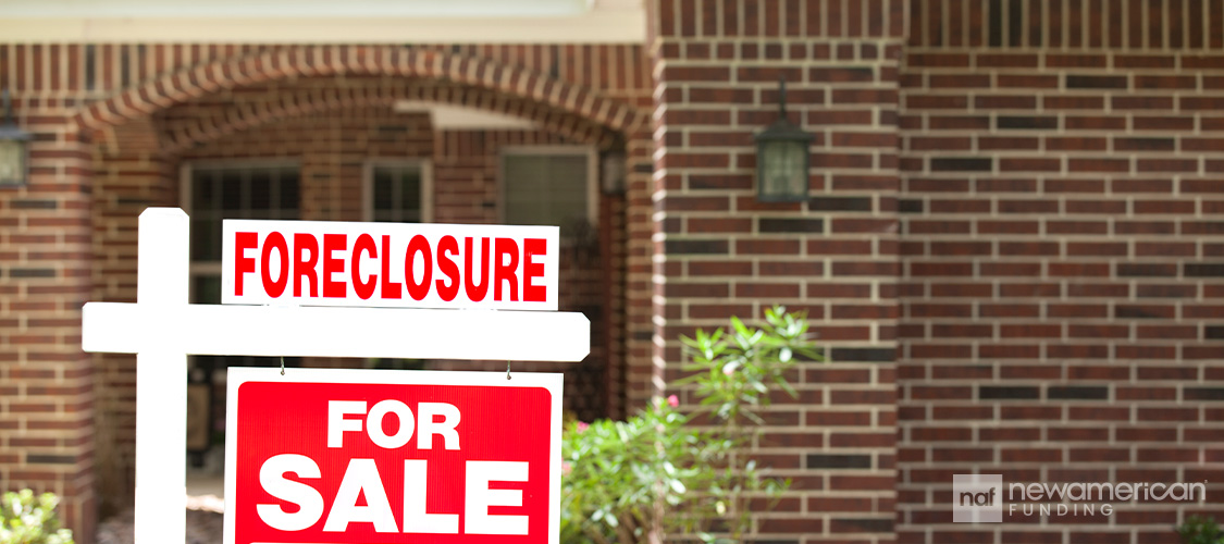 A foreclosure sign tacked onto a For Sale sign.