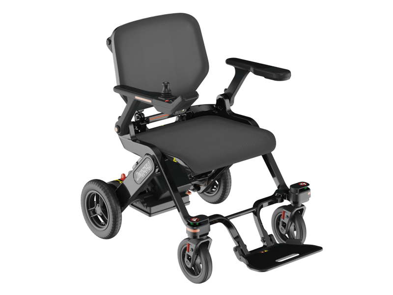 Pride Jazzy Assist powered wheelchair with a padded seat and backrest, flip-up armrests, joystick control, large rear wheels, front castors and a footplate.