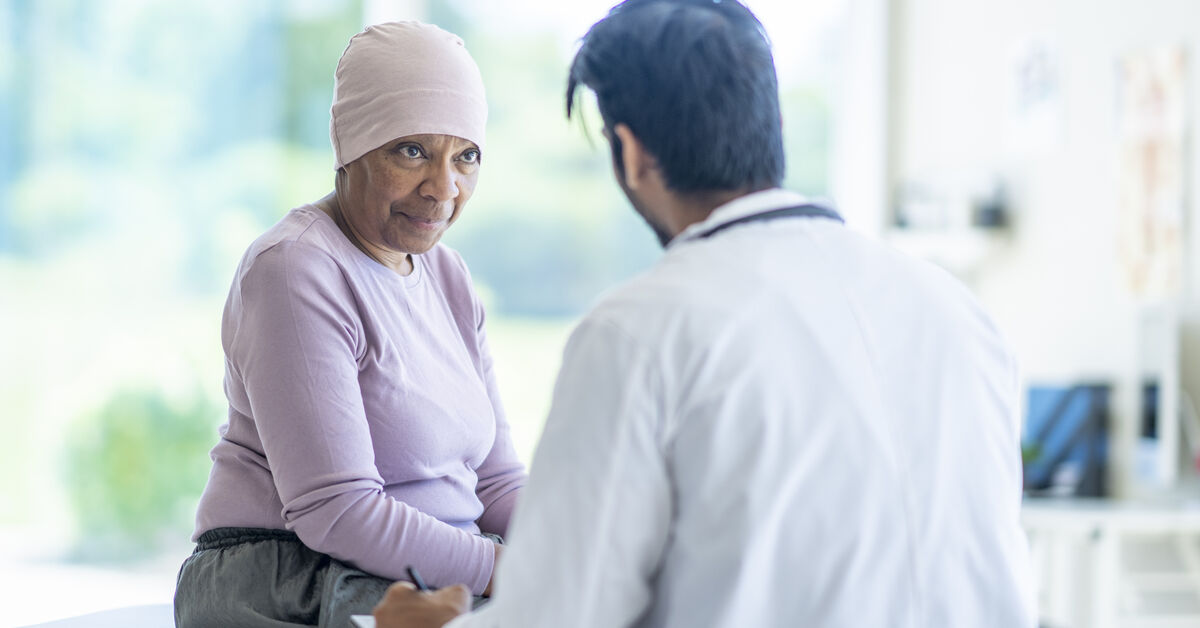 senior female patient speaks with doctor