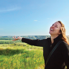 Michelle Duppong gestures joyfully to the beauty of the North Dakota Badlands during a visit to Theodore Roosevelt National Park around 2013. (Courtesy of the Duppong family)