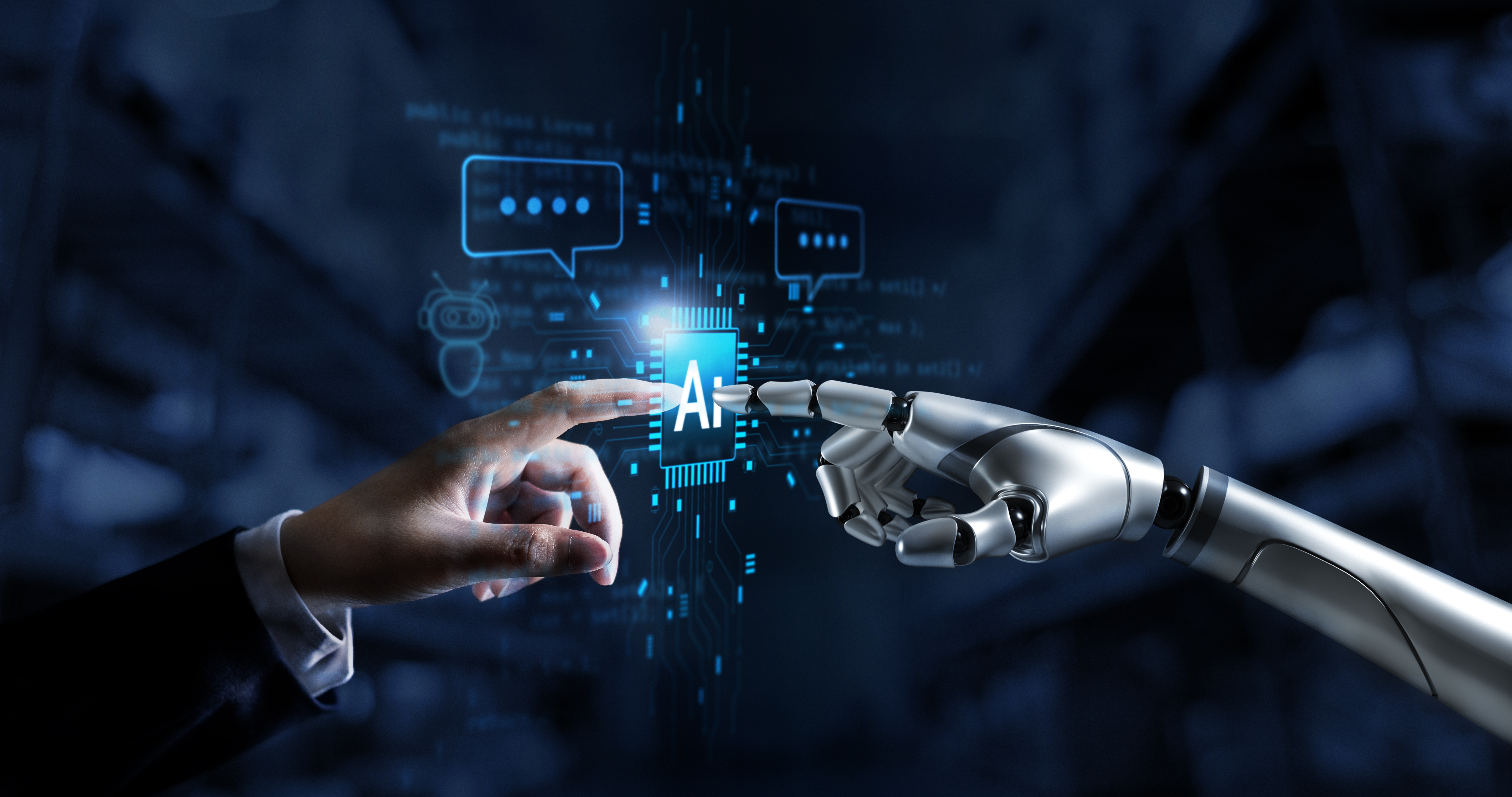 A human hand and a metallic robotic hand extend their index fingers to touch a central, glowing blue microprocessor chip labeled "AI." The background is a dark, tech-themed environment filled with floating digital code, circuitry patterns, and speech bubble icons, symbolizing the intersection of human and artificial intelligence.