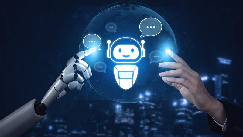 A futuristic digital composition showing a robotic hand and a human hand reaching out to touch a glowing blue icon of a smiling chatbot. The chatbot is centered within a translucent globe, surrounded by digital speech bubbles and a blurred night-time city skyline in the background.