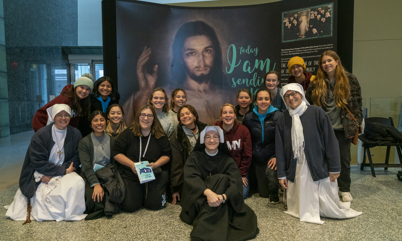Sisters pose for photo with a group attending Evenings with the Merciful Jesus.