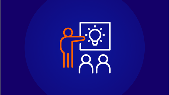 An icon of a person with an orange outline pointing to a board with a lightbulb idea illustration on it, in front of two white outline people sitting down. This represents an assessment, presentation, or teaching session.