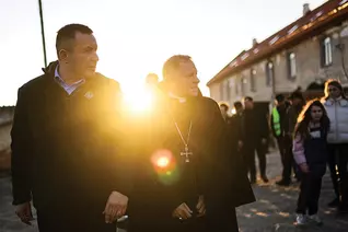 Ukraine State Deputy Youriy Maletskiy and Archbishop Mieczysław Mokrzycki visit Ukrainian families taking refuge at a monastery in Rava-Ruska in western Ukraine on April 12, 2022. (Photo by Andrey Gorb)