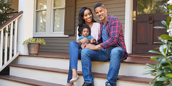 family sitting on front stairs