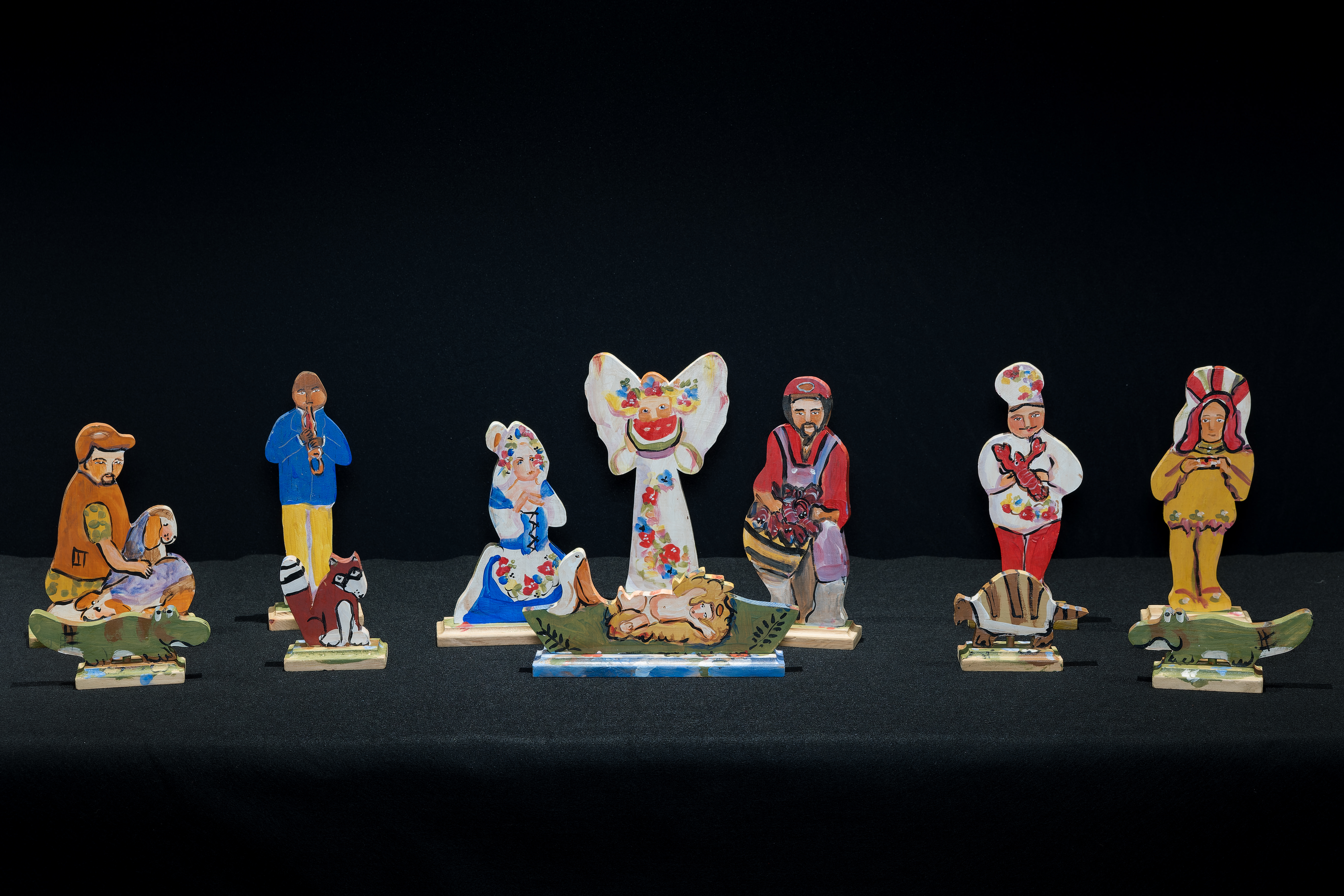 Painted wood carved nativity scene depicted as Louisiana Cajun culture. 