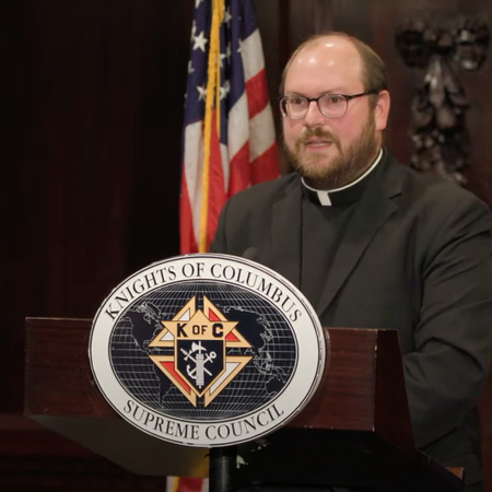 Father Michael Ruminski speaks in the Council Chamber of the Blessed Michael McGivney Pilgrimage Center on August 12, 2023.