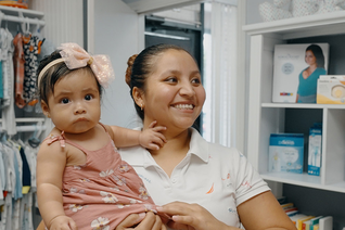 A client of Loving Choice Pregnancy Help Center in Spring, Texas, and her daughter visit the center’s clothing boutique. Loving Choice expanded its space by about 50% in 2021 with help from St. Clare of Assisi Council 9708 in Houston. Photo by Castletown Media
