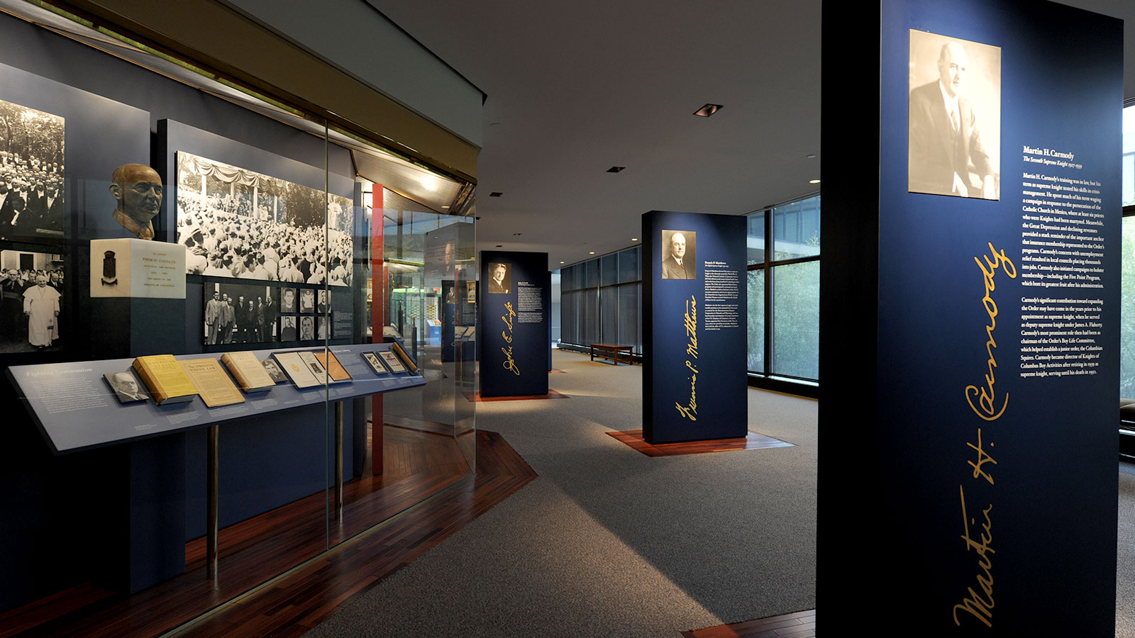 Photo of the Wall of History exhibit looking toward the pylons of Supreme Knights Martin Carmody, Francis Matthews, and John Swift 