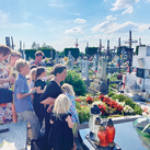 Kelly Lindquist and her children pray at the grave site of the Ulma family.
