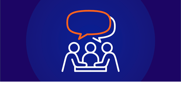A white line-art icon on a dark blue background showing three stylized people seated around a table, with an orange and white speech bubble floating above them, symbolizing a discussion, interview, or endpoint assessment.