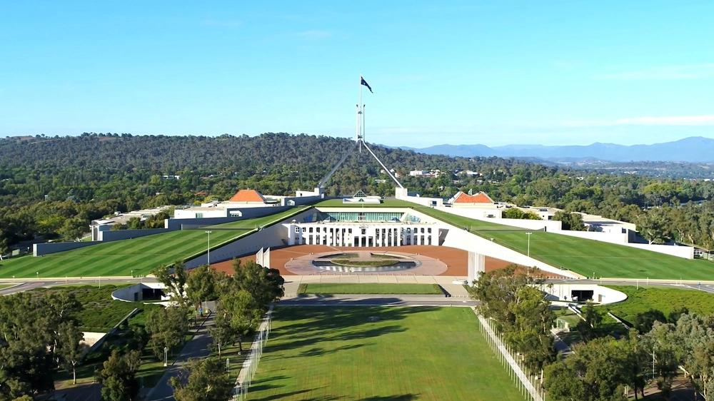Still from the video: Vocus: Trusted government solutions, aerial exterior shot of Parliament House, Canberra